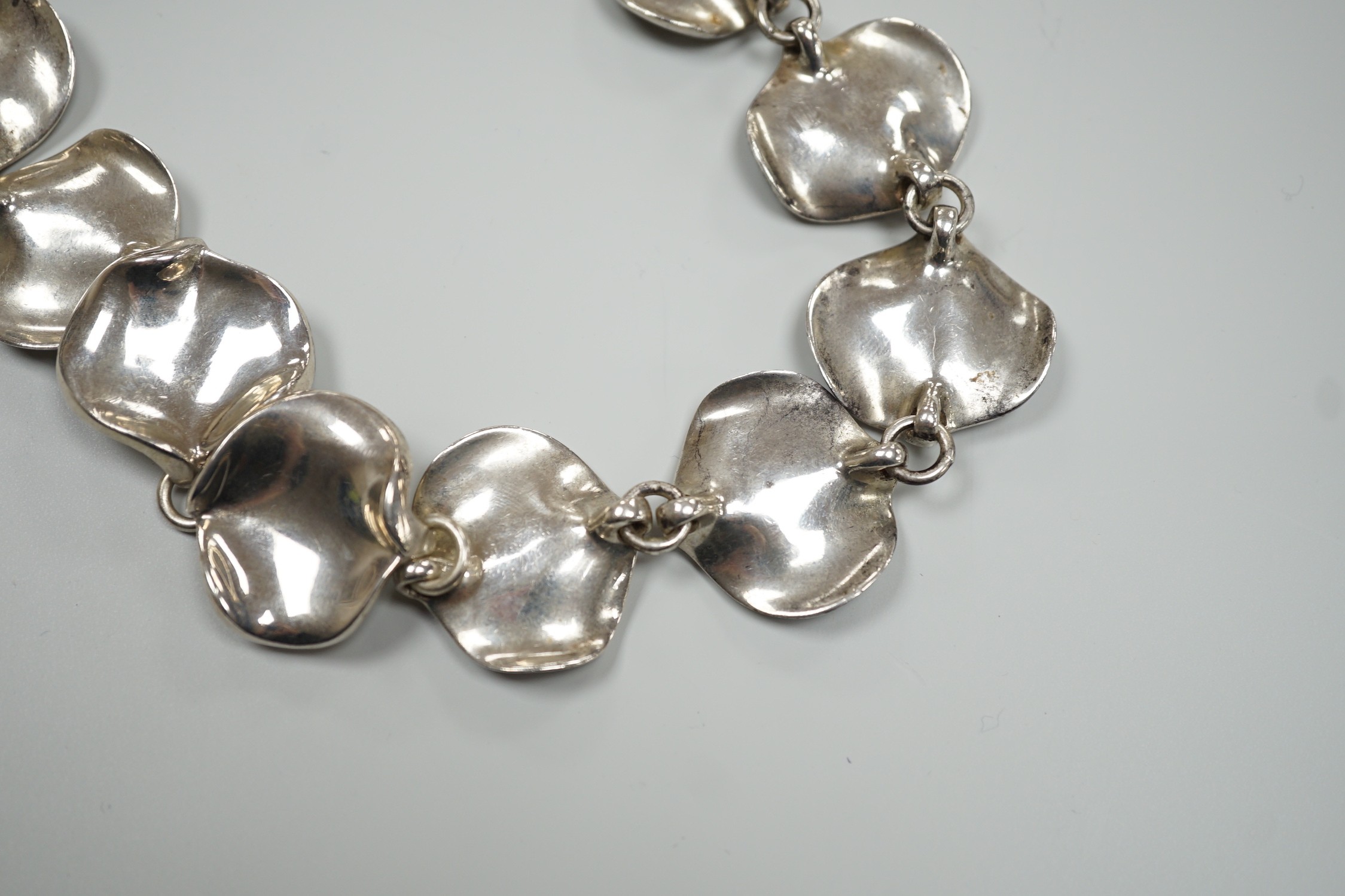 A modern Georg Jensen style silver necklace, with stylised petal links, maker AoL, London, 2008, 44cm, 189 grams.